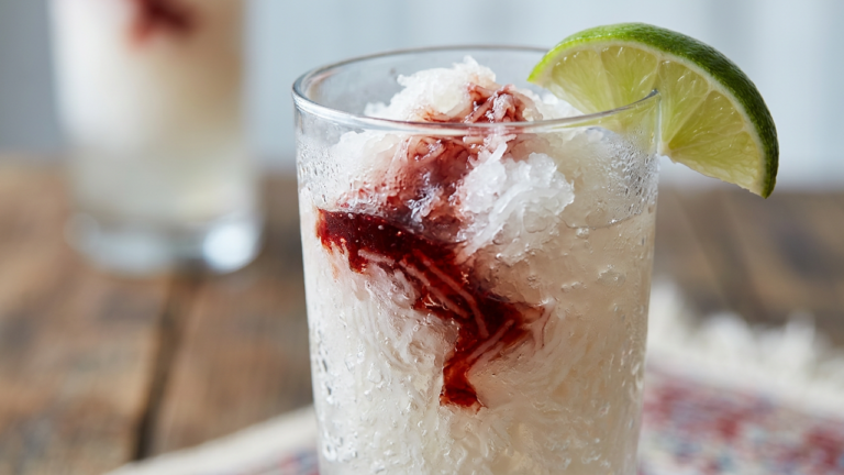Glass of Persian faloodeh rosewater vermicelli sorbet with sour cherry syrup